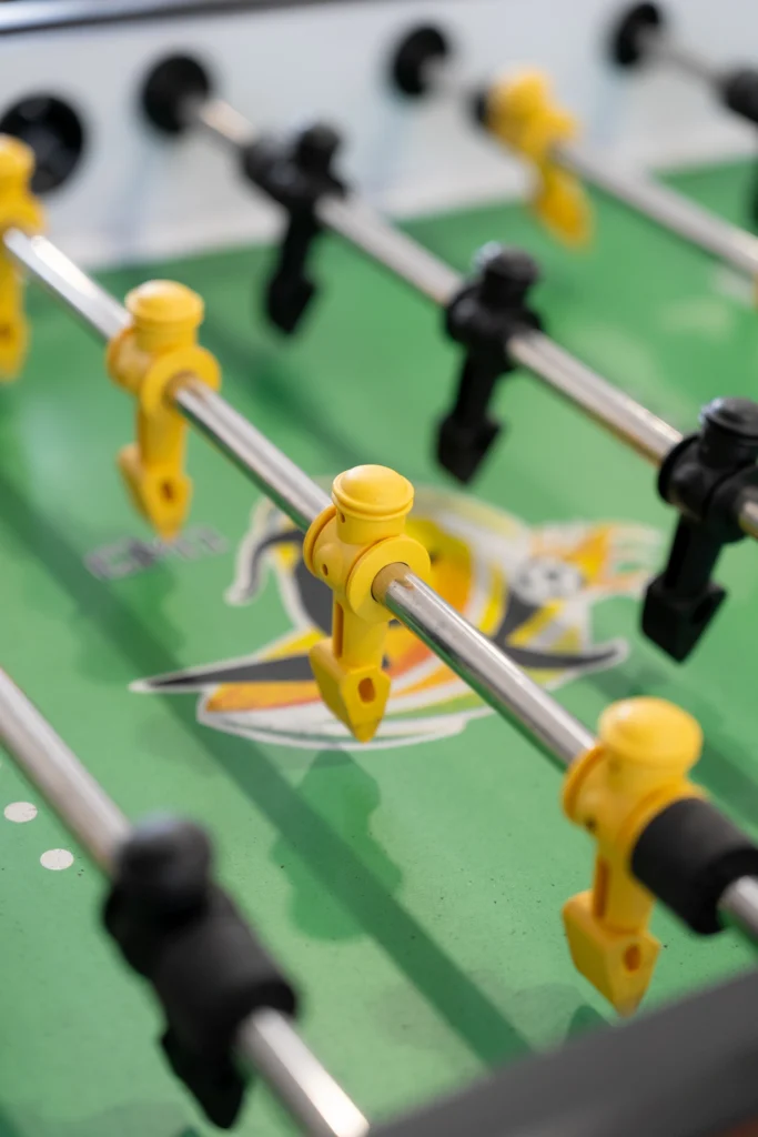 A close-up of the table football table in the boarding house games room.