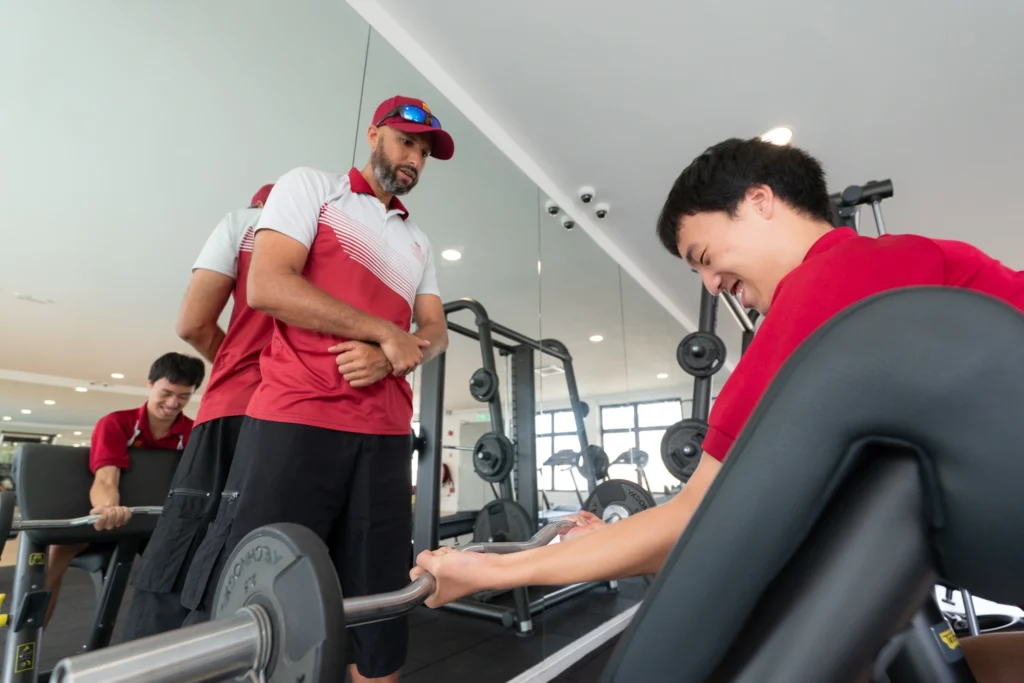 A student trains in the school gym.