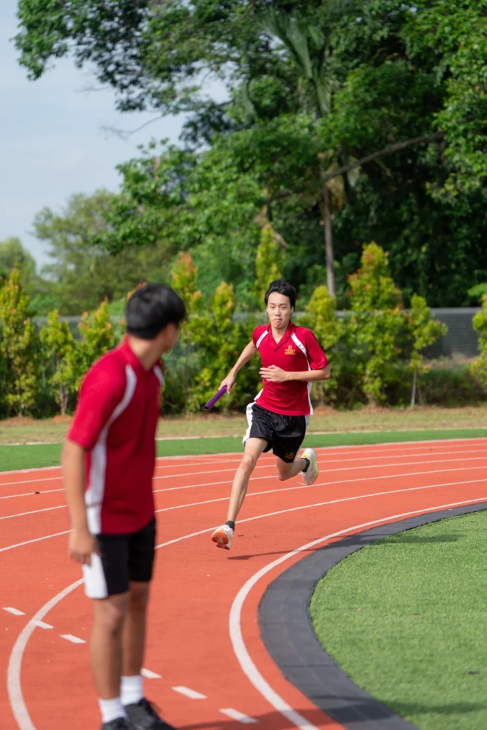 Students train on the school running track.