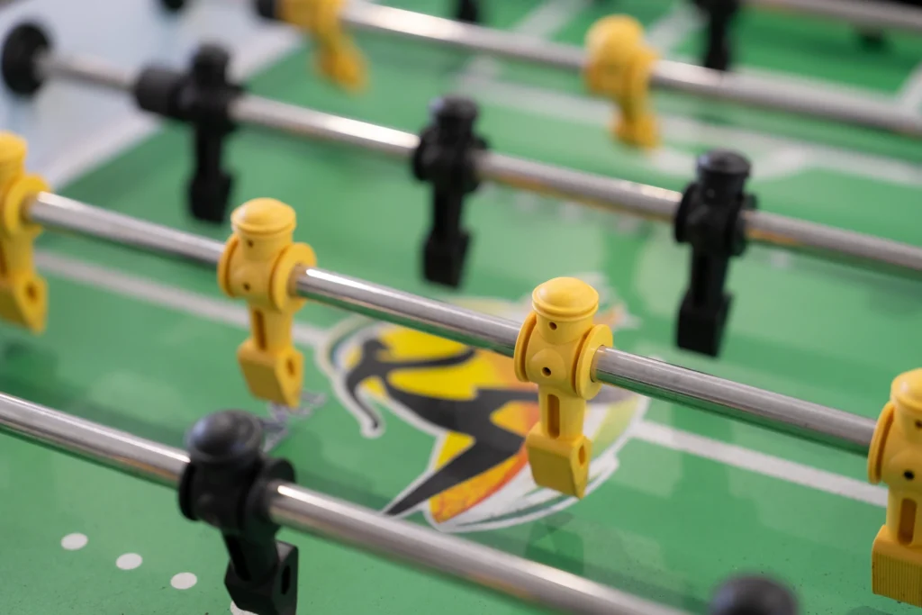 The table football game in the boarding house common room.