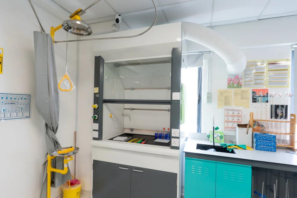 A chemistry laboratory fume cupboard and preparation area with an emergency shower.