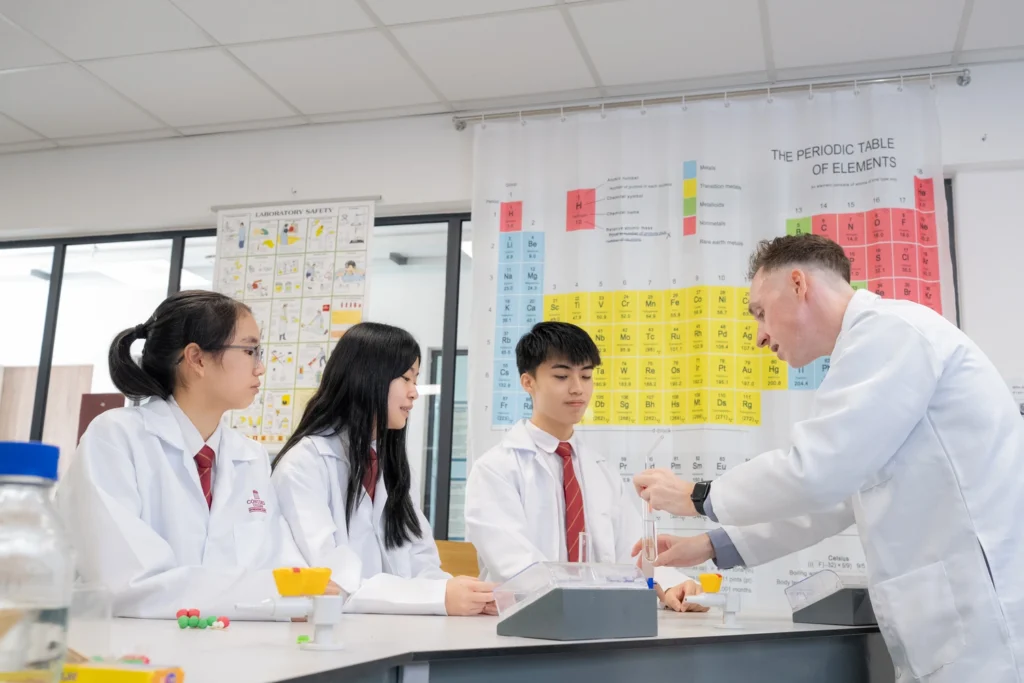 Students working at the bench during a chemistry lesson.