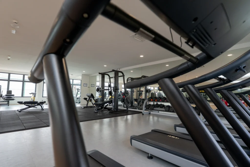 Cardio machines and free weights in the school gymnasium.